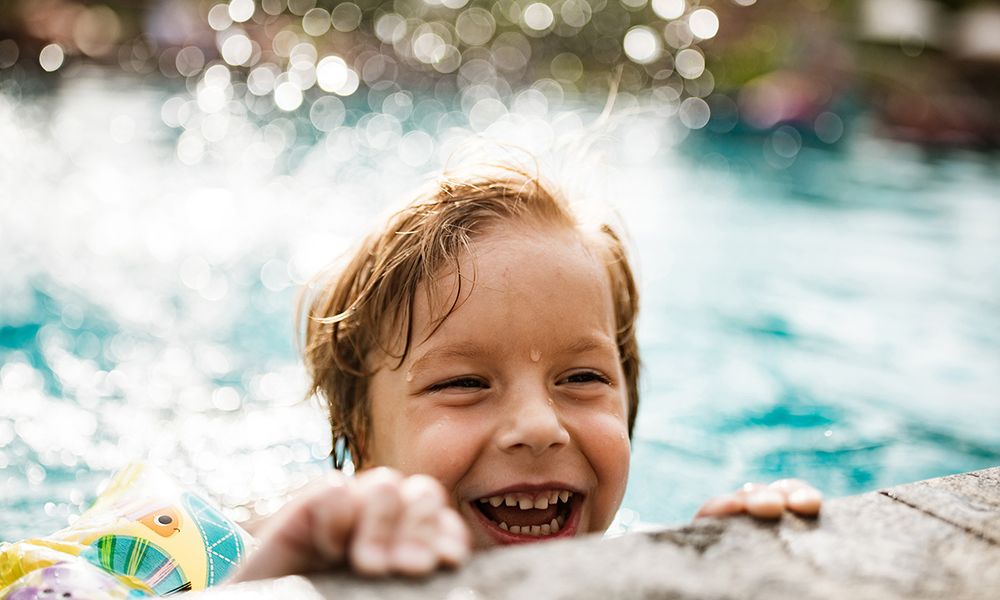 Kid playing in pool